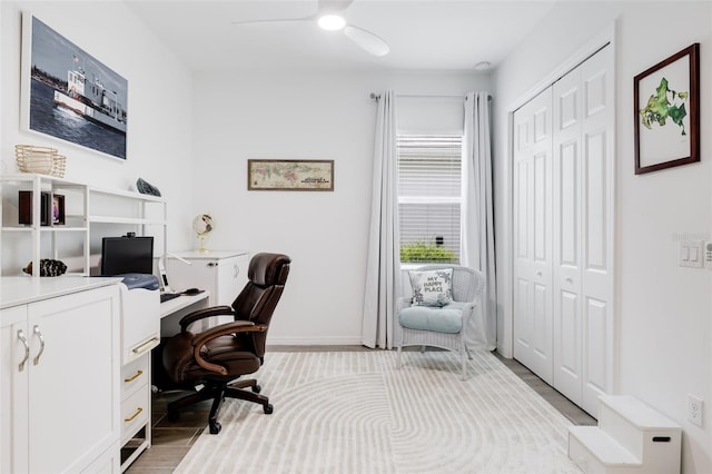 office space featuring light hardwood / wood-style floors and ceiling fan