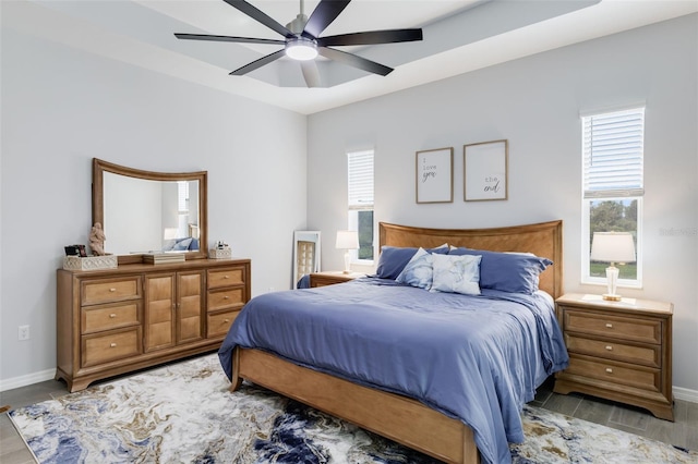 bedroom with ceiling fan and light hardwood / wood-style floors