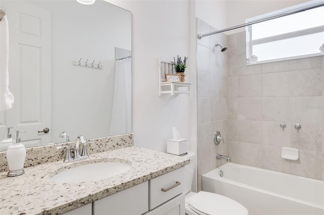 full bathroom with shower / bathtub combination with curtain, vanity, and toilet