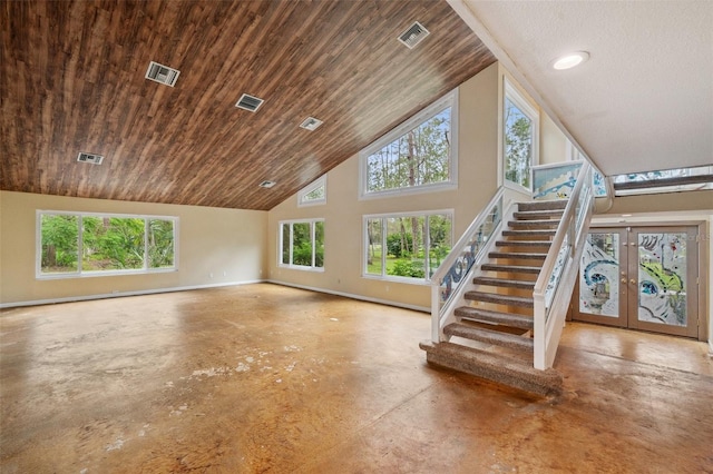 unfurnished living room featuring wood ceiling, french doors, high vaulted ceiling, and concrete flooring