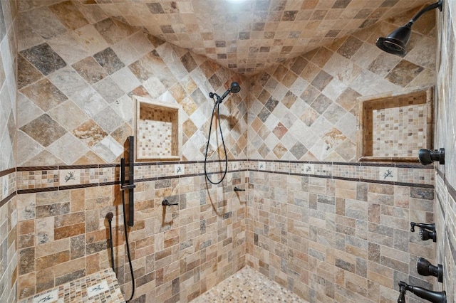 bathroom featuring tiled shower