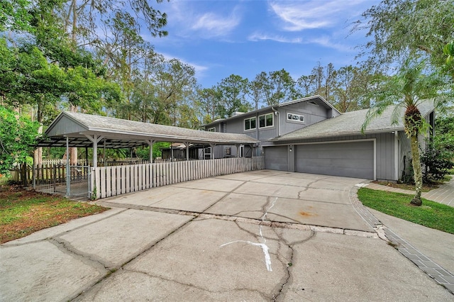 view of front of house featuring a garage and a carport