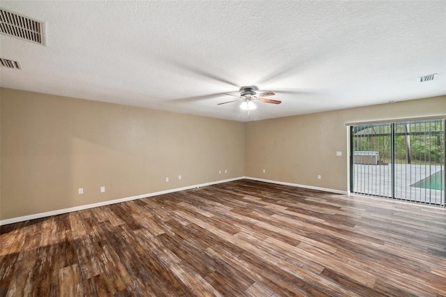 spare room with ceiling fan, hardwood / wood-style floors, and a textured ceiling