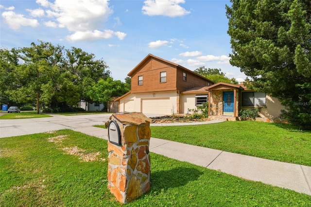 view of front of home featuring a garage and a front yard