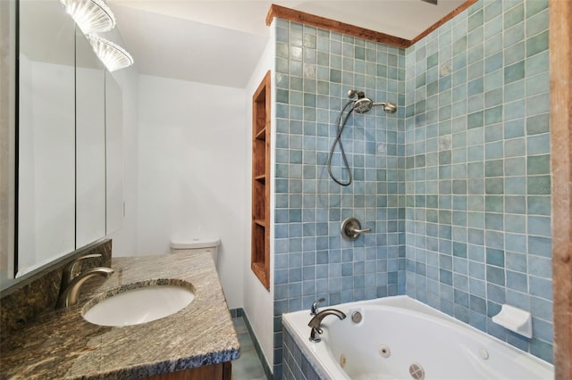 bathroom with vanity and tiled shower / bath