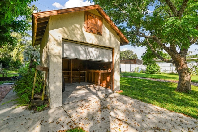 garage with a yard