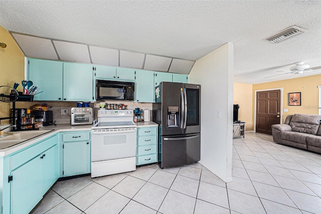 kitchen featuring stainless steel refrigerator with ice dispenser, backsplash, light tile patterned floors, and white range with electric stovetop