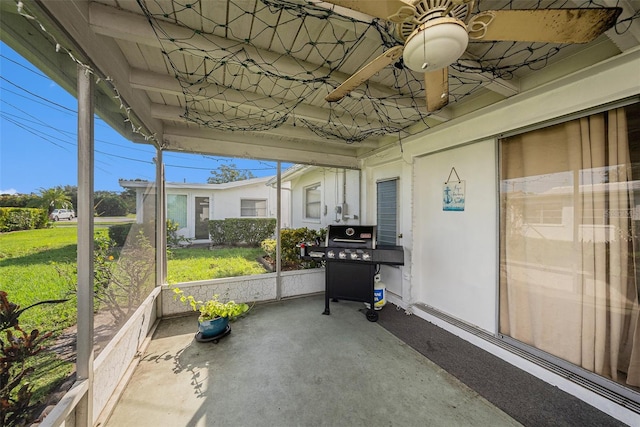 sunroom / solarium featuring ceiling fan