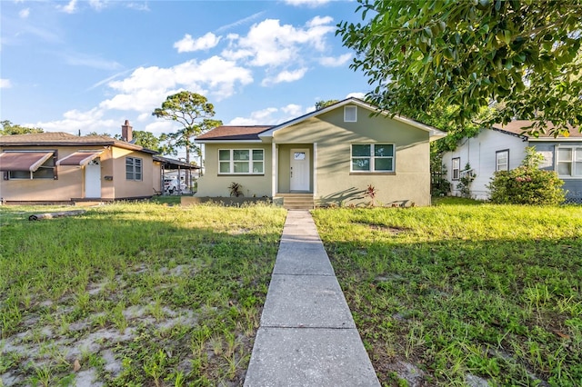 view of front of house with a front lawn