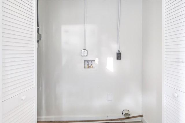 washroom with washer hookup, hookup for an electric dryer, and wood-type flooring