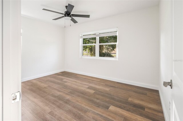 spare room featuring ceiling fan and hardwood / wood-style floors