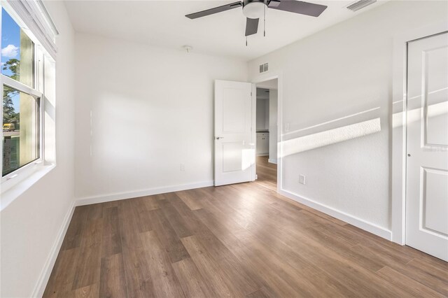 spare room featuring ceiling fan and hardwood / wood-style flooring