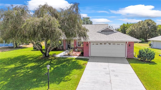 view of front of house with a garage and a front yard