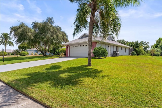 view of front facade with a front lawn and a garage