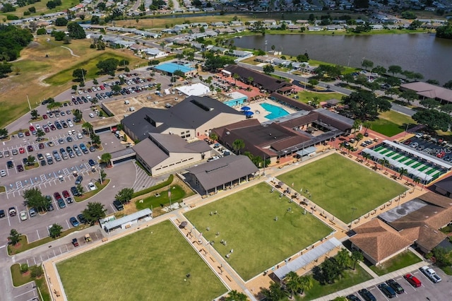 birds eye view of property with a water view