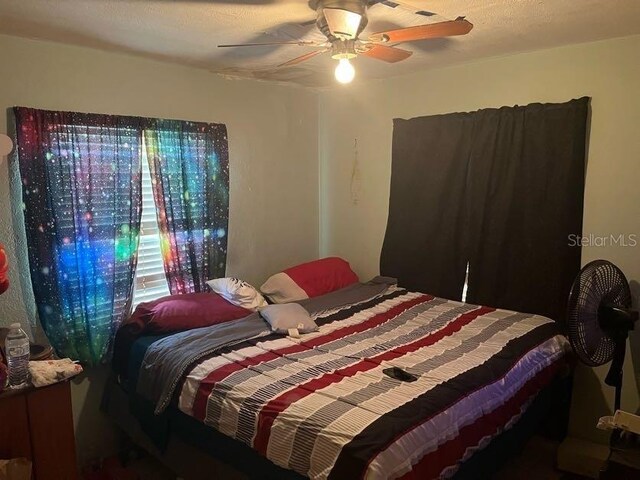 bedroom featuring ceiling fan