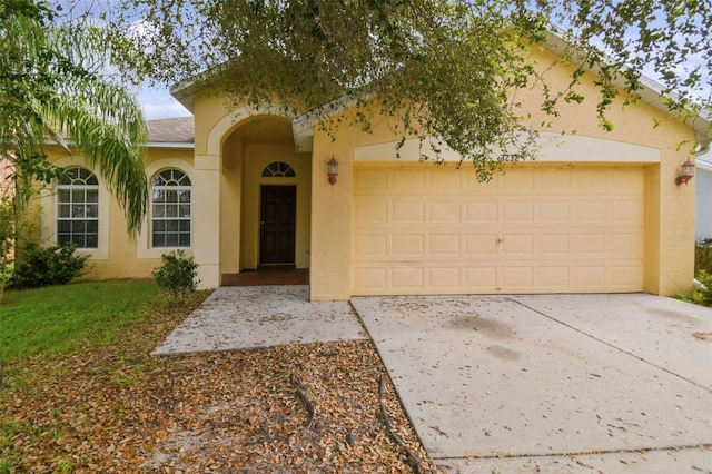 view of front of property with a garage