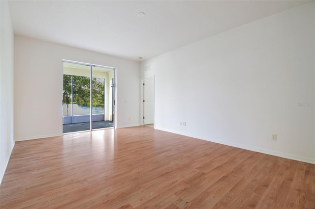 spare room with light hardwood / wood-style floors