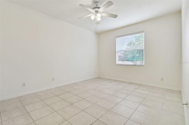 unfurnished room featuring ceiling fan and light tile patterned flooring