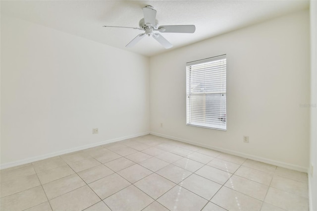 tiled empty room with ceiling fan