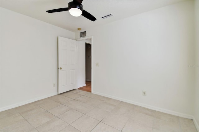 unfurnished room featuring light tile patterned flooring and ceiling fan