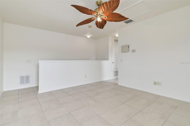 unfurnished room featuring ceiling fan and light tile patterned flooring