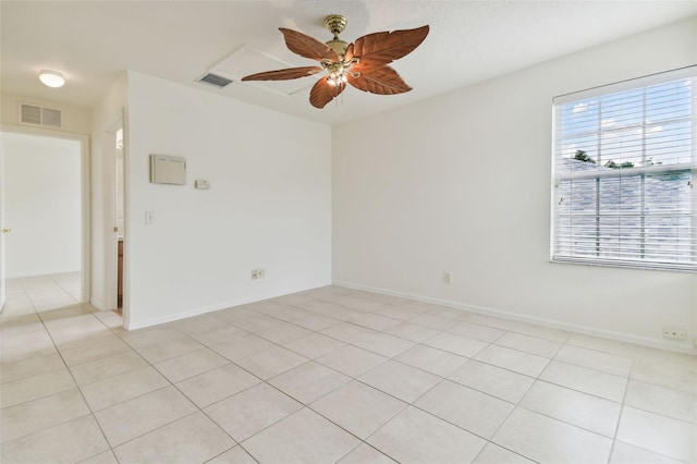 empty room featuring ceiling fan and light tile patterned floors