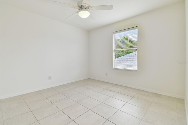 unfurnished room featuring light tile patterned floors and ceiling fan