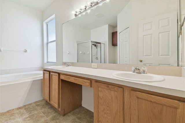 bathroom featuring tile patterned flooring, independent shower and bath, and vanity