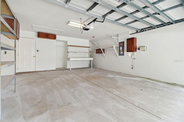 garage with electric panel and a garage door opener