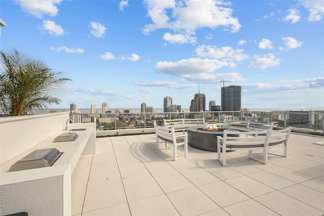 view of patio with an outdoor fire pit