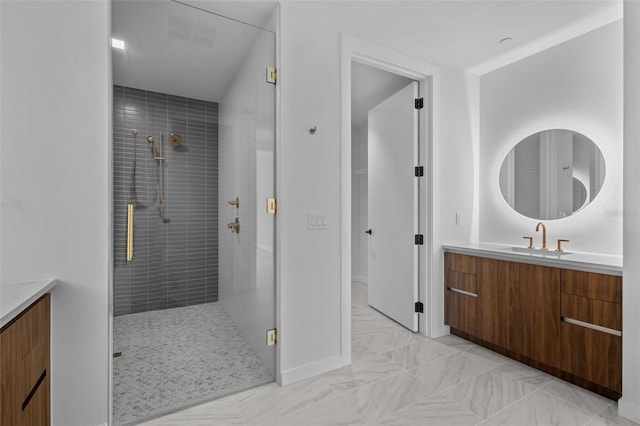 bathroom with vanity and a shower with shower door