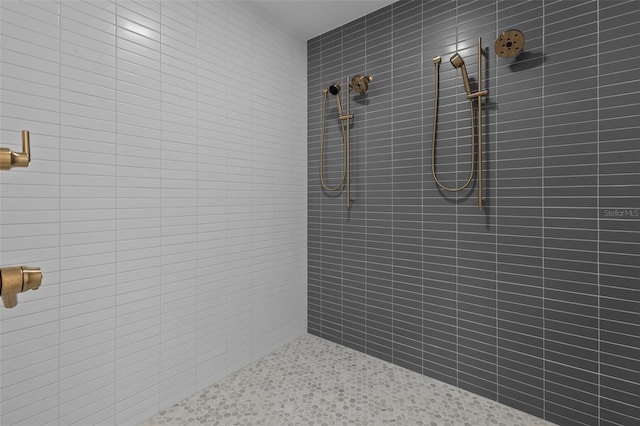 bathroom with a tile shower