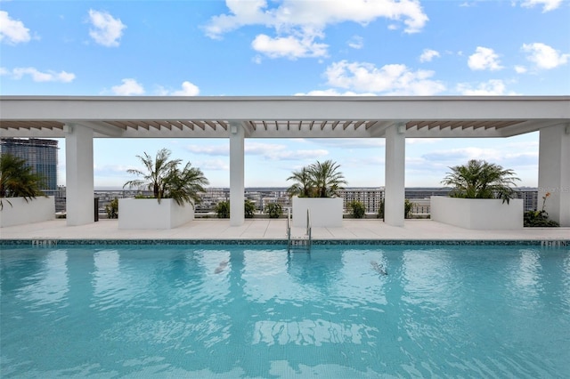 view of swimming pool featuring a patio area