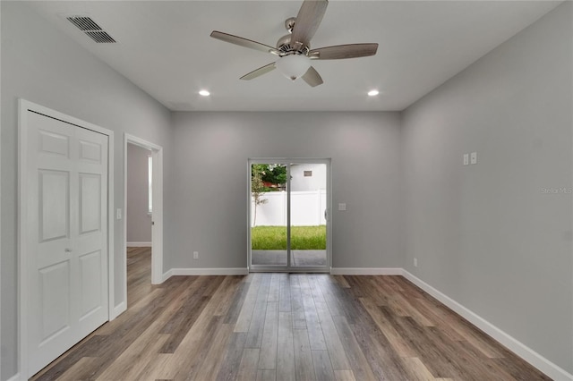 empty room with light wood-type flooring and ceiling fan