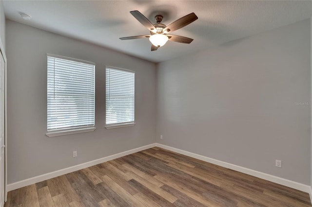 empty room featuring ceiling fan and wood-type flooring