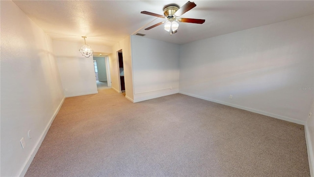 carpeted empty room with ceiling fan