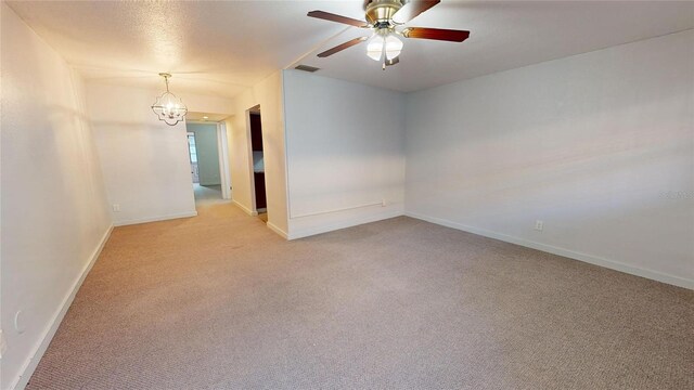 unfurnished room featuring light carpet and ceiling fan