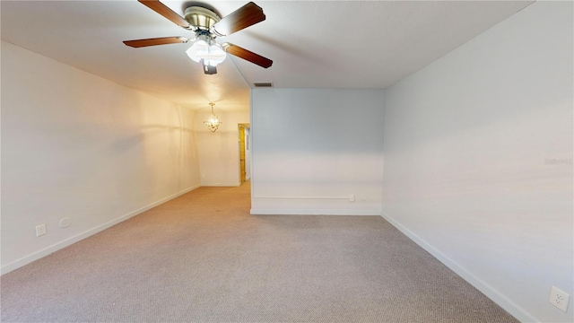 spare room with light carpet and ceiling fan