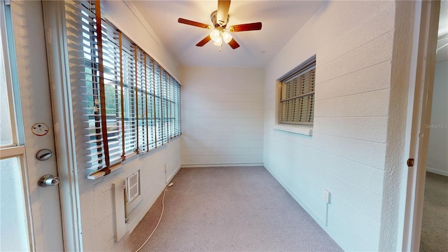 interior space featuring ceiling fan