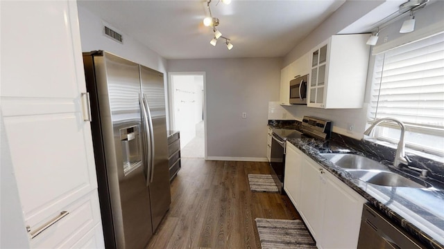 kitchen featuring sink, white cabinets, and appliances with stainless steel finishes