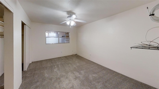 unfurnished bedroom with ceiling fan, carpet floors, and a closet