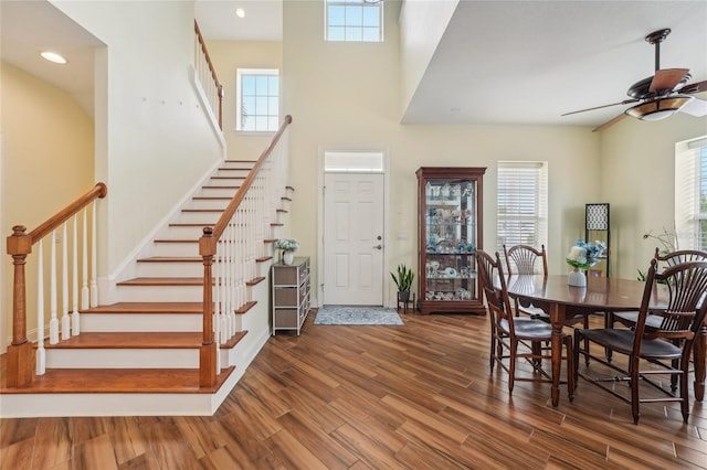 dining space with dark hardwood / wood-style floors and ceiling fan