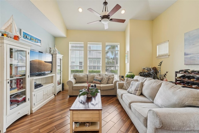 living room with wood-type flooring and ceiling fan