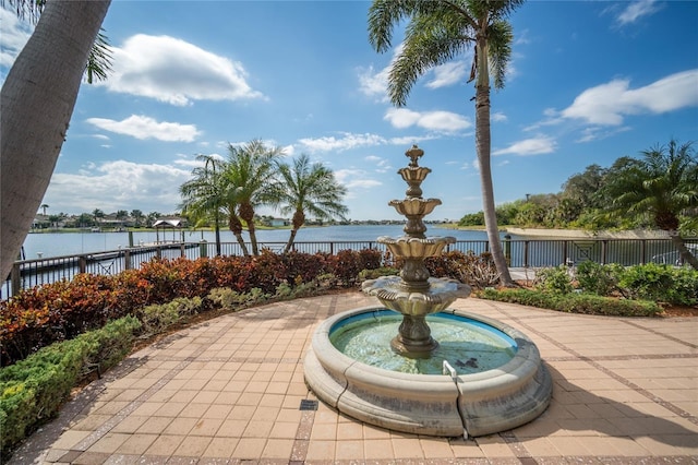 view of pool with a water view