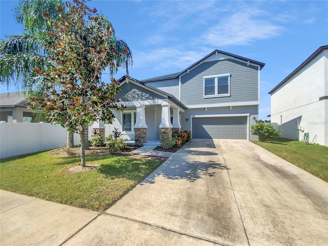 view of front facade with a garage and a front yard