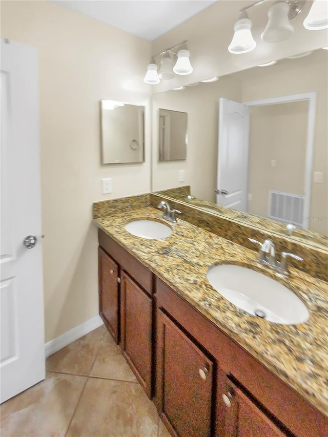 bathroom with tile patterned flooring and vanity