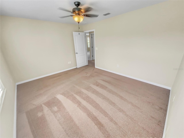 unfurnished room featuring carpet floors and ceiling fan