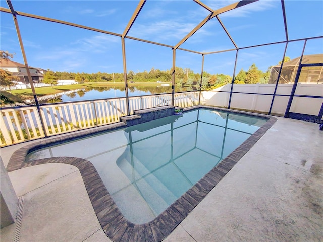 view of swimming pool with a lanai, a patio, and a water view