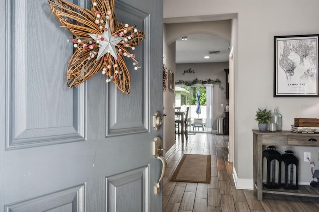 foyer entrance featuring dark hardwood / wood-style floors